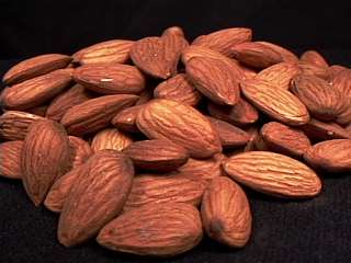 raw, unblanched, California almonds in a pile.